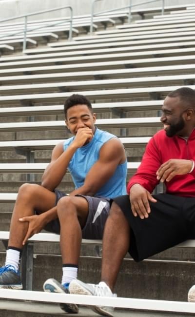 A man enjoying time with his coach